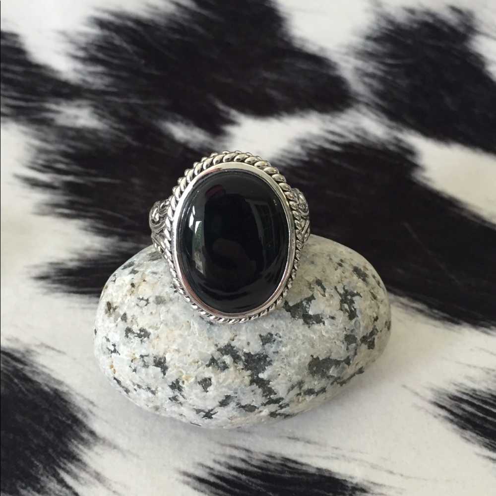 Silver tones intricate detailed ring